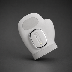 Front view of the ThermaPalm Hand Massager, a portable device providing compression and heat therapy for hand relief.