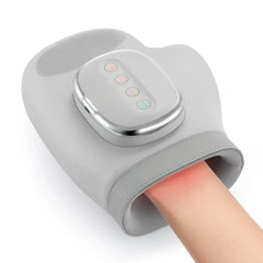 Gray handheld massager with digital display on a white background